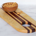 Beaded Japanese Walnut snack bowl, 4.5" x 1.75" , shown with Handmade Birdseye Maple and Bloodwood Charcuterie board 