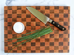 Walnut and cherry "checkered" end grain cutting board, shown with knife and chives, Top view, 12" x 16" 