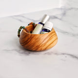 Olive Wood Snack Bowl,Shown with bracelet and essential oils bottles (not included) Isometric View, 3.5" x 2"